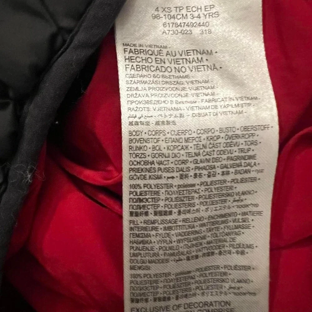 Nike black puffer jacket with red accents, size XS